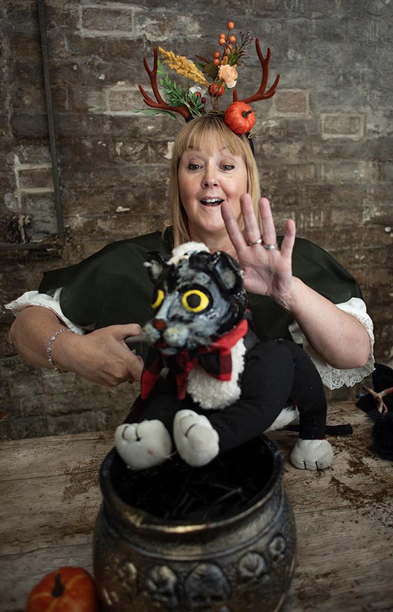 Rachel Goodall performing with a handmade puppet cat